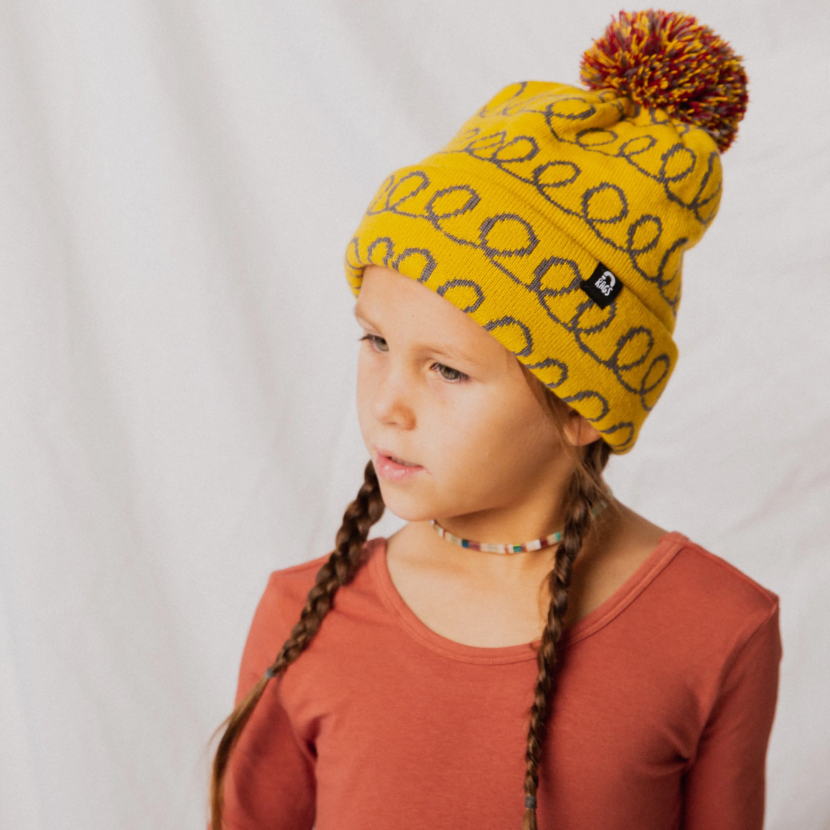 Pom Beanie - 'Yellow Loops'