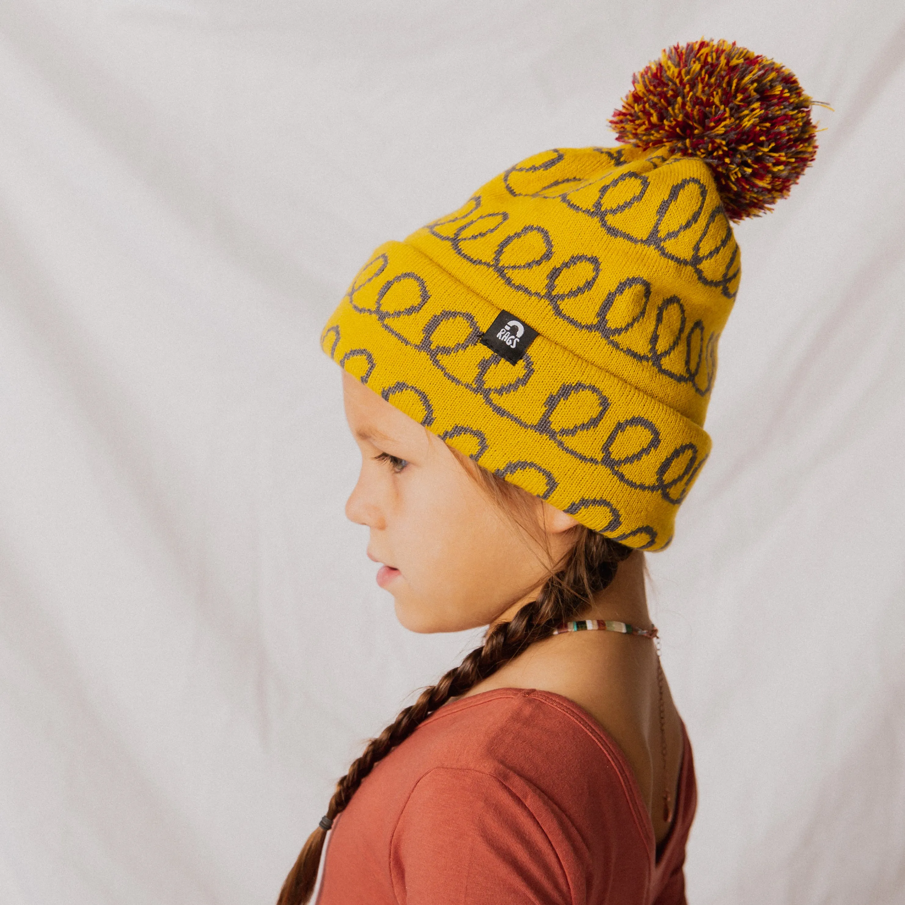 Pom Beanie - 'Yellow Loops'